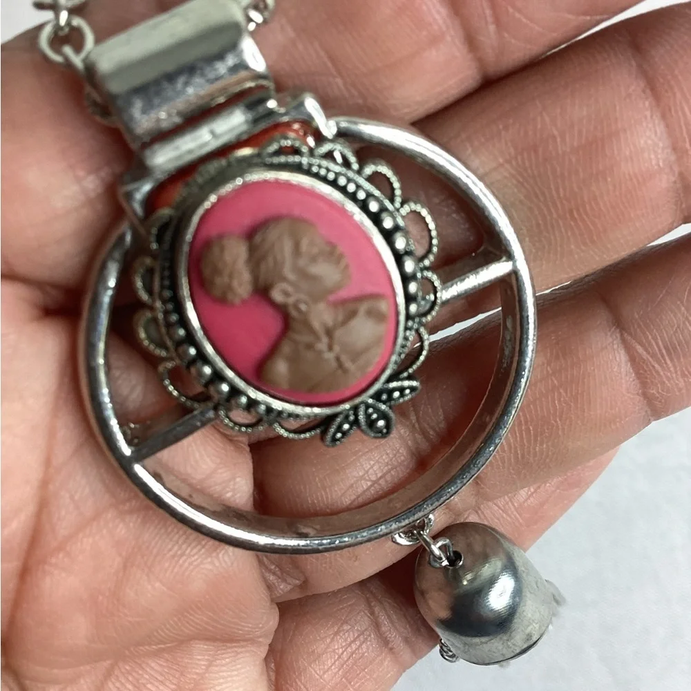 Pink and sliver cameo necklace.